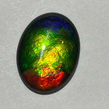 Load image into Gallery viewer, AAA ammolite calibrated cabochon. Beautiful red green and blue colours 20x15 mm high dome quartz cap