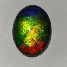 Load image into Gallery viewer, AAA ammolite calibrated cabochon. Beautiful red green and blue colours 20x15 mm high dome quartz cap