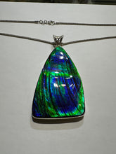 Load image into Gallery viewer, Beautiful hand-polished ammolite necklace set in silver, featuring bright vibrant blues and greens
