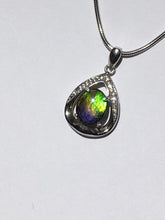 Load image into Gallery viewer, Small Ammolite pendant set in Sterling Silver with Cubic Zirconia.  Very cute & dainty.