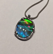 Load image into Gallery viewer, Ammolite pendant in Sterling silver setting with small starfish holding the stone in place. Amazing colour and lustre.
