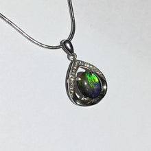 Load image into Gallery viewer, Small Ammolite pendant set in Sterling Silver with Cubic Zirconia.  Very cute & dainty.