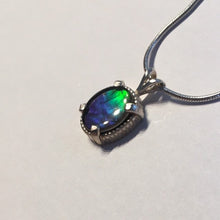 Load image into Gallery viewer, Ammolite pendant In Sterling Silver with beautiful lustre and vibrant colours of the rainbow.