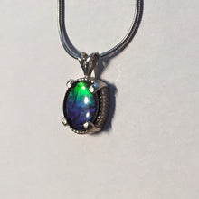 Load image into Gallery viewer, Ammolite pendant In Sterling Silver with beautiful lustre and vibrant colours of the rainbow.