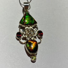 Load image into Gallery viewer, Ammolite pendant Sterling Silver with garnet and peridot really pretty with little flowers in the setting!