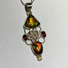 Load image into Gallery viewer, Ammolite pendant Sterling Silver with garnet and peridot really pretty with little flowers in the setting!