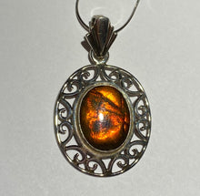 Load image into Gallery viewer, Ammolite pendant in Sterling Silver with colour changing from orange to green, very pretty oval cabochon.