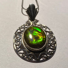 Load image into Gallery viewer, Ammolite pendant in Sterling Silver with colour changing from orange to green, very pretty oval cabochon.