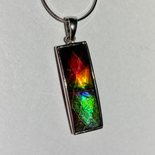 Load image into Gallery viewer, Ammolite pendant faceted set in Sterling Silver