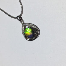 Load image into Gallery viewer, Small Ammolite pendant set in Sterling Silver with Cubic Zirconia.  Very cute & dainty.