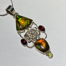Load image into Gallery viewer, Ammolite pendant Sterling Silver with garnet and peridot really pretty with little flowers in the setting!