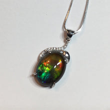 Load image into Gallery viewer, Ammolite pendant in Sterling Silver with Rhodium Plate and Cubic Zirconia. Beautiful rainbow colours and chromatic shift.