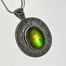 Load image into Gallery viewer, Ammolite pendant in Sterling Silver with beautiful green and blue shine.