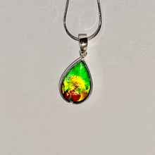 Load image into Gallery viewer, Ammolite pendant, vibrant green, yellow and red in sterling silver setting