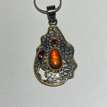 Load image into Gallery viewer, Ammolite pendant with black rhodium and gold plate with ruby
