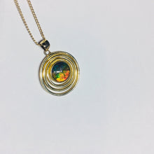 Load image into Gallery viewer, Rainbow Ammolite pendant in gold plated sterling silver setting