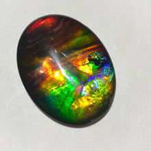 Load image into Gallery viewer, AAA+ ammolite calibrated cabochon. Beautiful rainbow colours. 40x30 mm low dome quartz cap