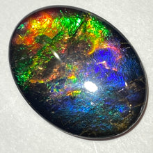 Load image into Gallery viewer, AAA+ ammolite calibrated cabochon. Beautiful pink spots and rainbows. 30x22 mm low dome quartz cap
