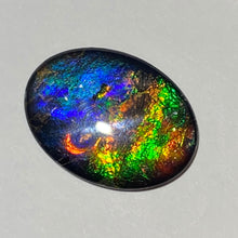 Load image into Gallery viewer, AAA+ ammolite calibrated cabochon. Beautiful pink spots and rainbows. 30x22 mm low dome quartz cap