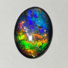 Load image into Gallery viewer, AAA+ ammolite calibrated cabochon. Beautiful pink spots and rainbows. 30x22 mm low dome quartz cap