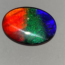 Load image into Gallery viewer, AAA+ ammolite calibrated cabochon. Beautiful red, sparkling aqua and blue colours. 25x18 mm low dome quartz cap