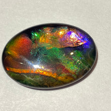 Load image into Gallery viewer, AAA+ ammolite calibrated cabochon. Exceptional colours and depth in this beautiful stone with pink and purple. 25x18 mm low dome quartz cap