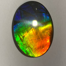 Load image into Gallery viewer, AAA+ ammolite calibrated cabochon. Beautiful rainbow colours. 40x30 mm low dome quartz cap