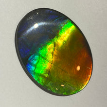 Load image into Gallery viewer, AAA+ ammolite calibrated cabochon. Beautiful rainbow colours. 40x30 mm low dome quartz cap