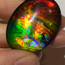 Load image into Gallery viewer, AAA+ ammolite calibrated cabochon. Beautiful rainbow colours. 40x30 mm low dome quartz cap