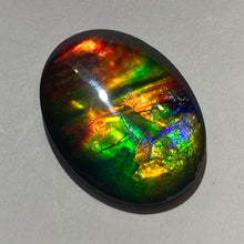 Load image into Gallery viewer, AAA+ ammolite calibrated cabochon. Beautiful rainbow colours. 40x30 mm low dome quartz cap