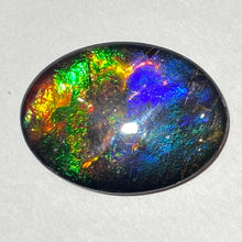 Load image into Gallery viewer, AAA+ ammolite calibrated cabochon. Beautiful pink spots and rainbows. 30x22 mm low dome quartz cap