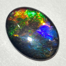 Load image into Gallery viewer, AAA+ ammolite calibrated cabochon. Beautiful pink spots and rainbows. 30x22 mm low dome quartz cap