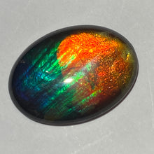 Load image into Gallery viewer, AAA+ ammolite calibrated cabochon. Beautiful rainbow colours. 30x 22 mm low dome quartz cap