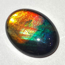 Load image into Gallery viewer, AAA+ ammolite calibrated cabochon. Beautiful rainbow colours. 30x 22 mm low dome quartz cap