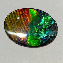 Load image into Gallery viewer, AAA+ ammolite calibrated cabochon. Beautiful blue, green, gold and red colours. 30x 22 mm low dome quartz cap