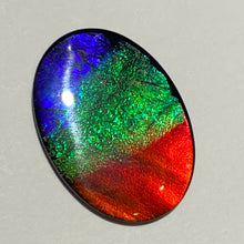 Load image into Gallery viewer, AAA+ ammolite calibrated cabochon. Beautiful red, sparkling aqua and blue colours. 25x18 mm low dome quartz cap