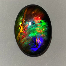 Load image into Gallery viewer, AAA+ ammolite calibrated cabochon. Exceptional colours and depth in this beautiful stone with pink and purple. 25x18 mm low dome quartz cap