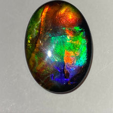 Load image into Gallery viewer, AAA+ ammolite calibrated cabochon. Exceptional colours and depth in this beautiful stone with pink and purple. 25x18 mm low dome quartz cap