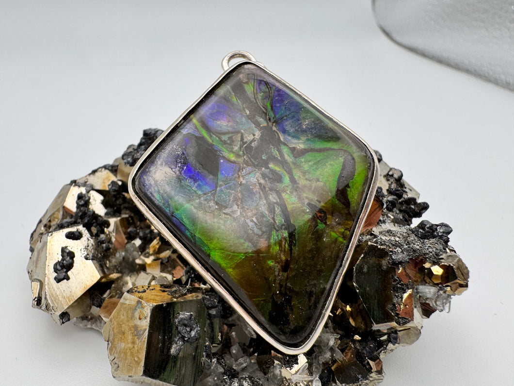 polished ammolite pendant