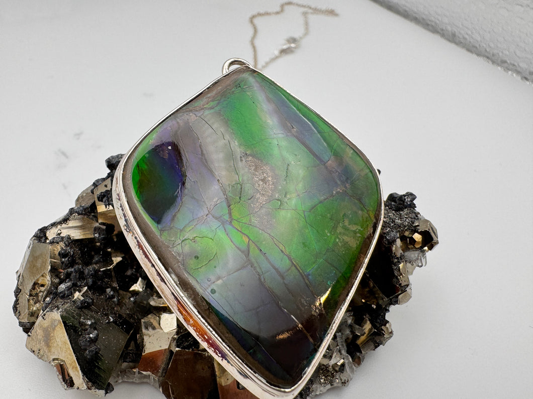 polished ammolite pendant