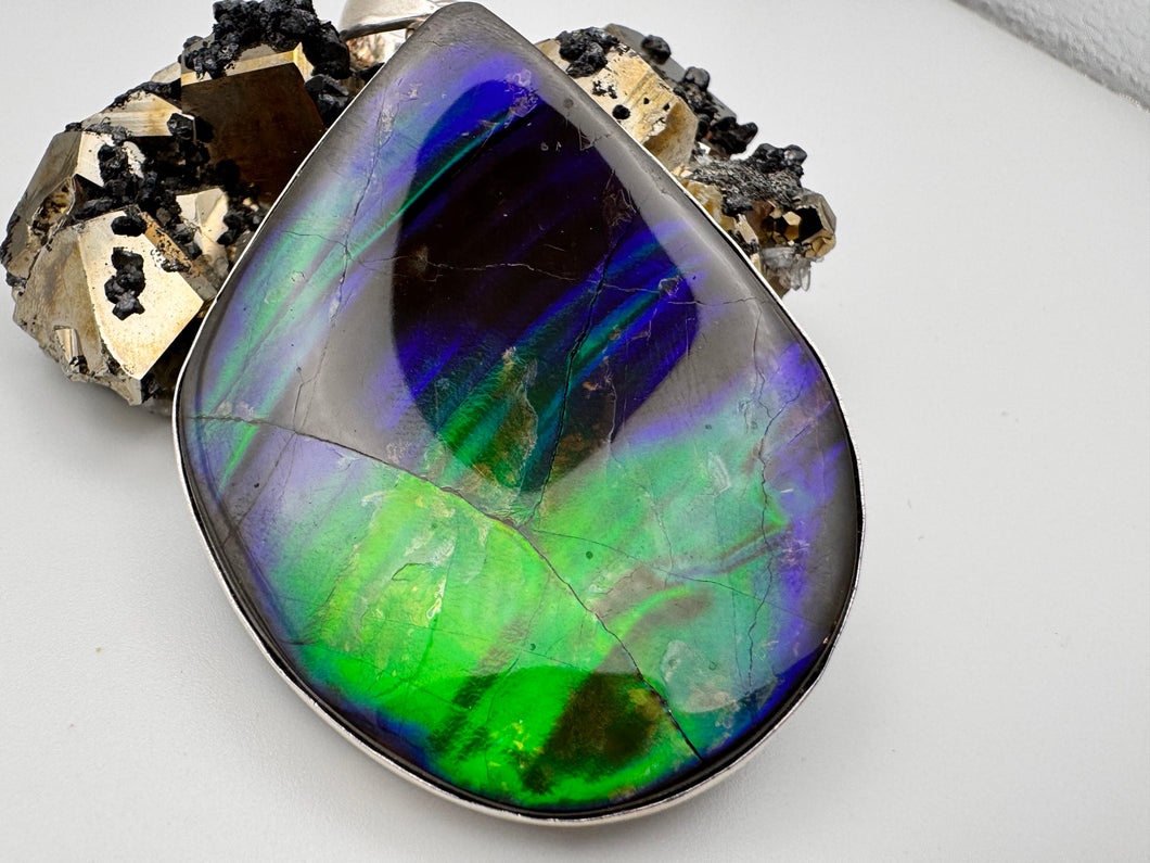 polished ammolite pendant