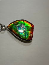 Load image into Gallery viewer, Beautiful ammolite necklace set in silver, featuring vibrant reds, yellows and blues
