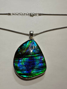 Beautiful ammolite necklace set in silver, featuring vibrant blues and greens