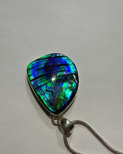 Beautiful ammolite necklace set in silver, featuring vibrant blues and greens