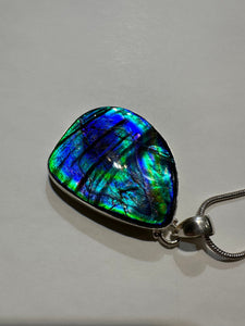 Beautiful ammolite necklace set in silver, featuring vibrant blues and greens