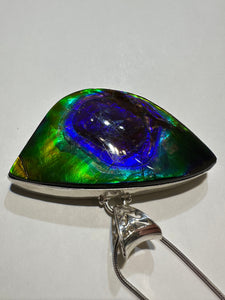 Beautiful ammolite necklace set in silver, featuring vibrant blues and purples