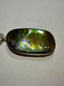 Natural Finish, Polished by hand! Beautiful ammolite necklace set in silver, featuring bright oranges and blues