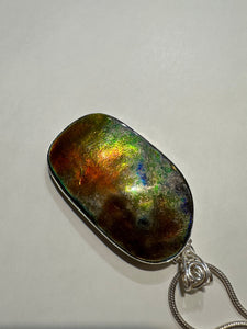 Natural Finish, Polished by hand! Beautiful ammolite necklace set in silver, featuring bright oranges and blues