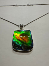 Load image into Gallery viewer, Beautiful ammolite necklace set in silver, with vibrant blues and oranges
