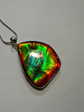 Load image into Gallery viewer, Beautiful ammolite necklace set in silver, featuring vibrant reds, yellows and blues
